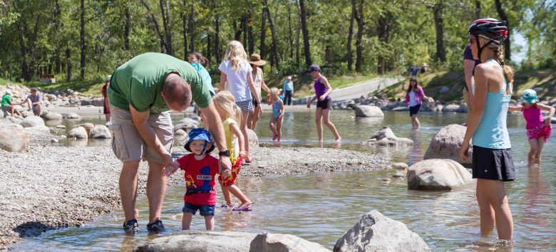 families playing in the river on st. patrick's island