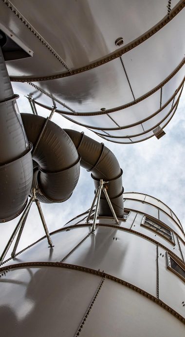 two silos with connecting slide