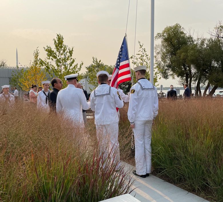 sailors raising flag at wayzata memorial